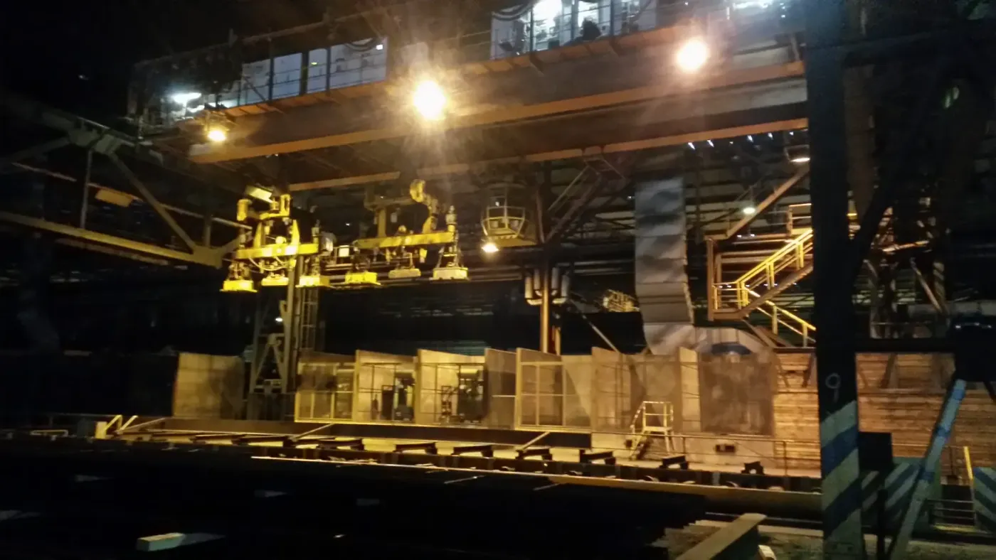 Magnet crane in the steel mill at night