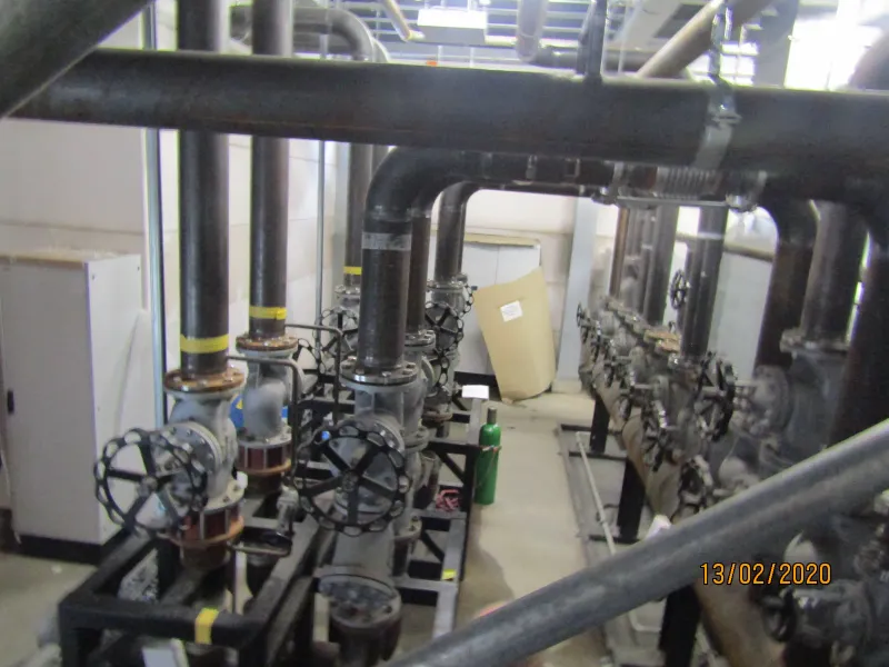 Pipework and valve rows along the plant room