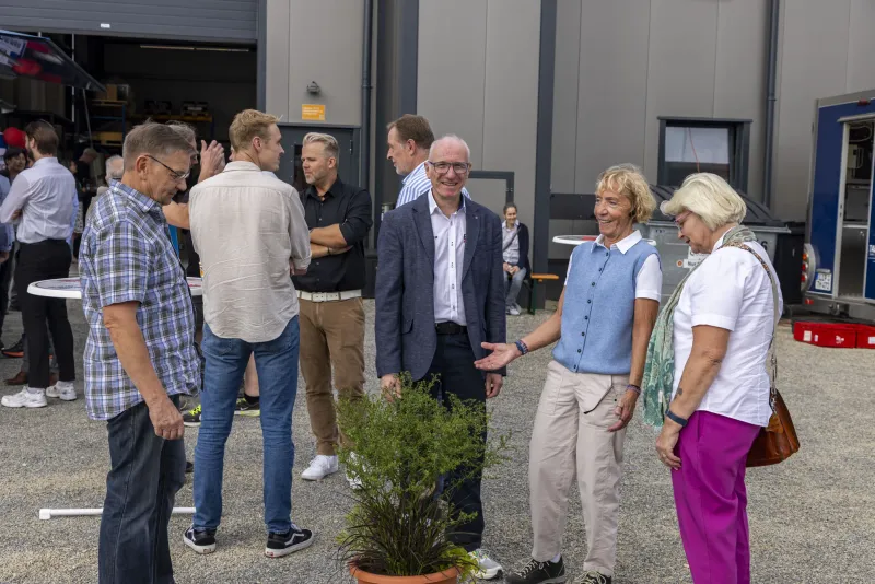 Guests in the yard outside the hall