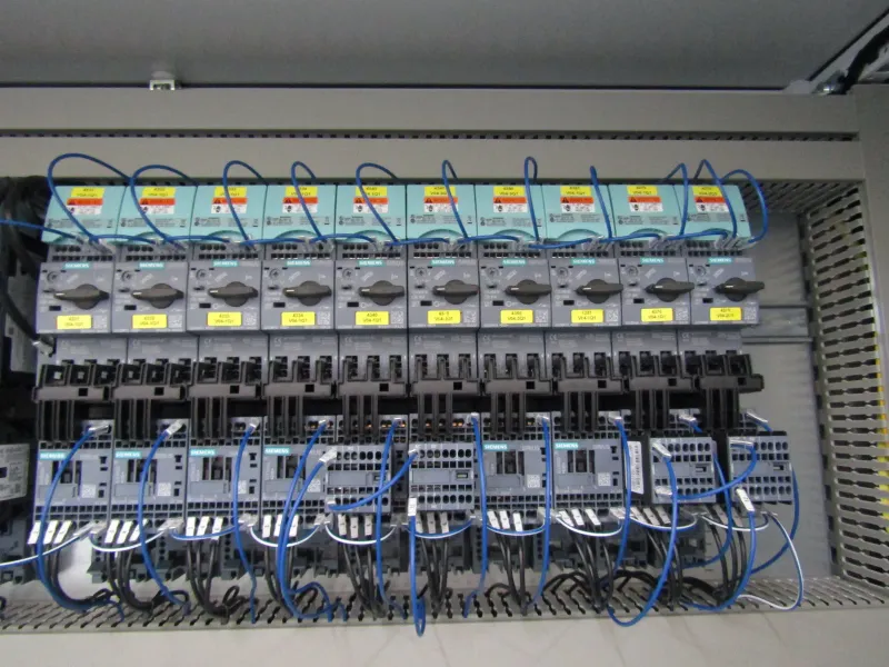 Row of motor starters inside the cabinet