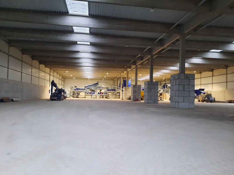 The large hall with the plant at the back