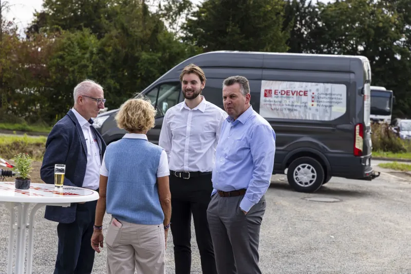 Talking in front of the E-Device van