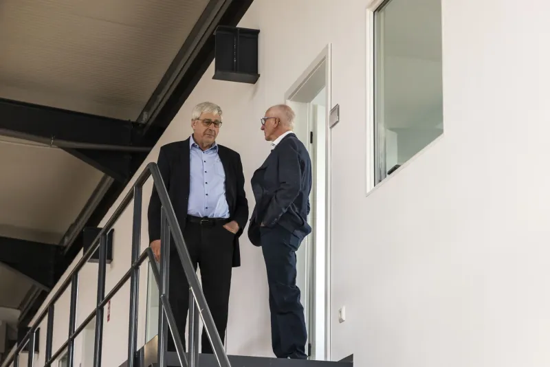Talking on the stairs to the office