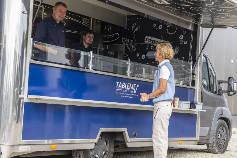 At the catering van