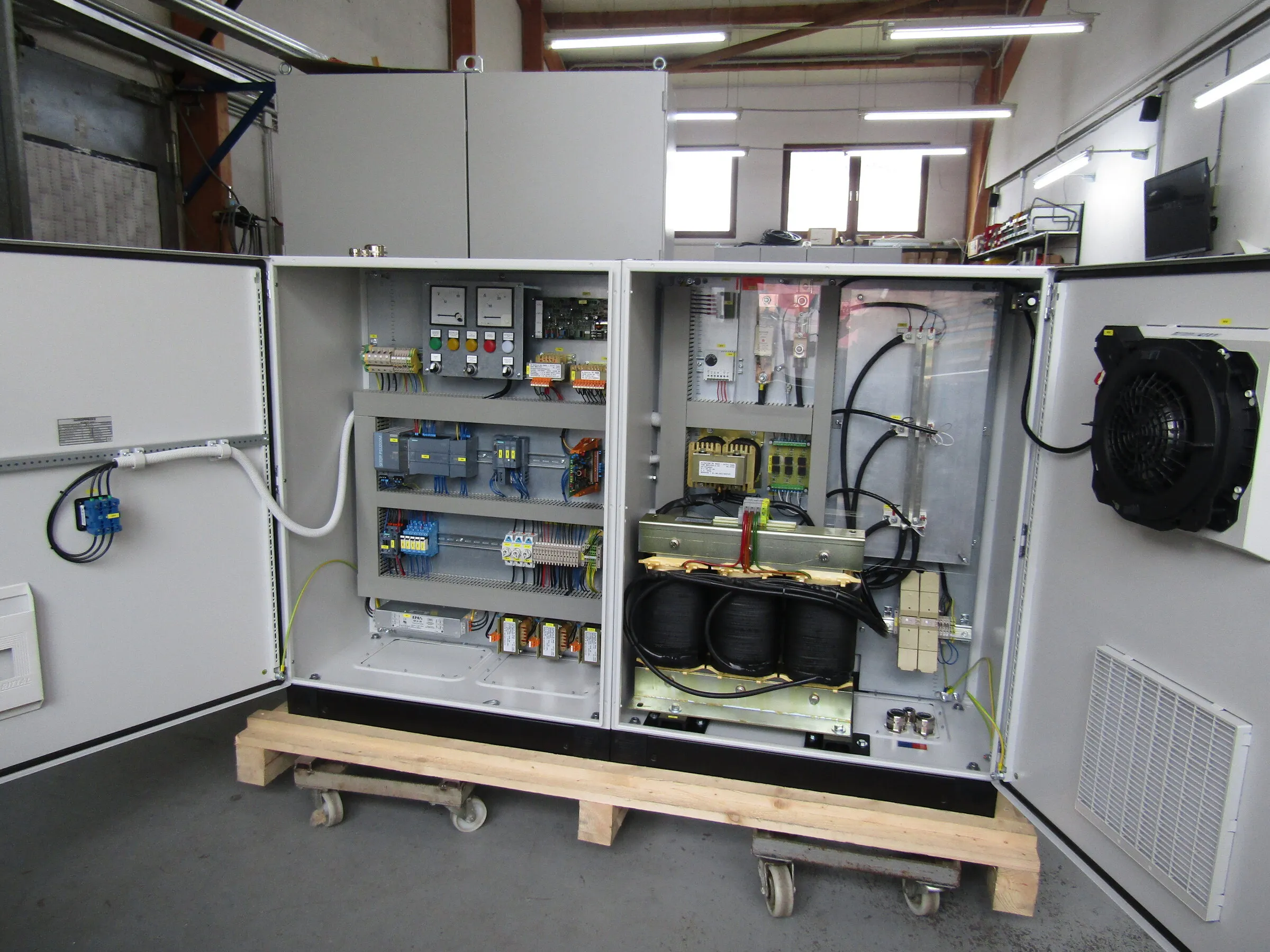 Open charger with control section, transformer and fan