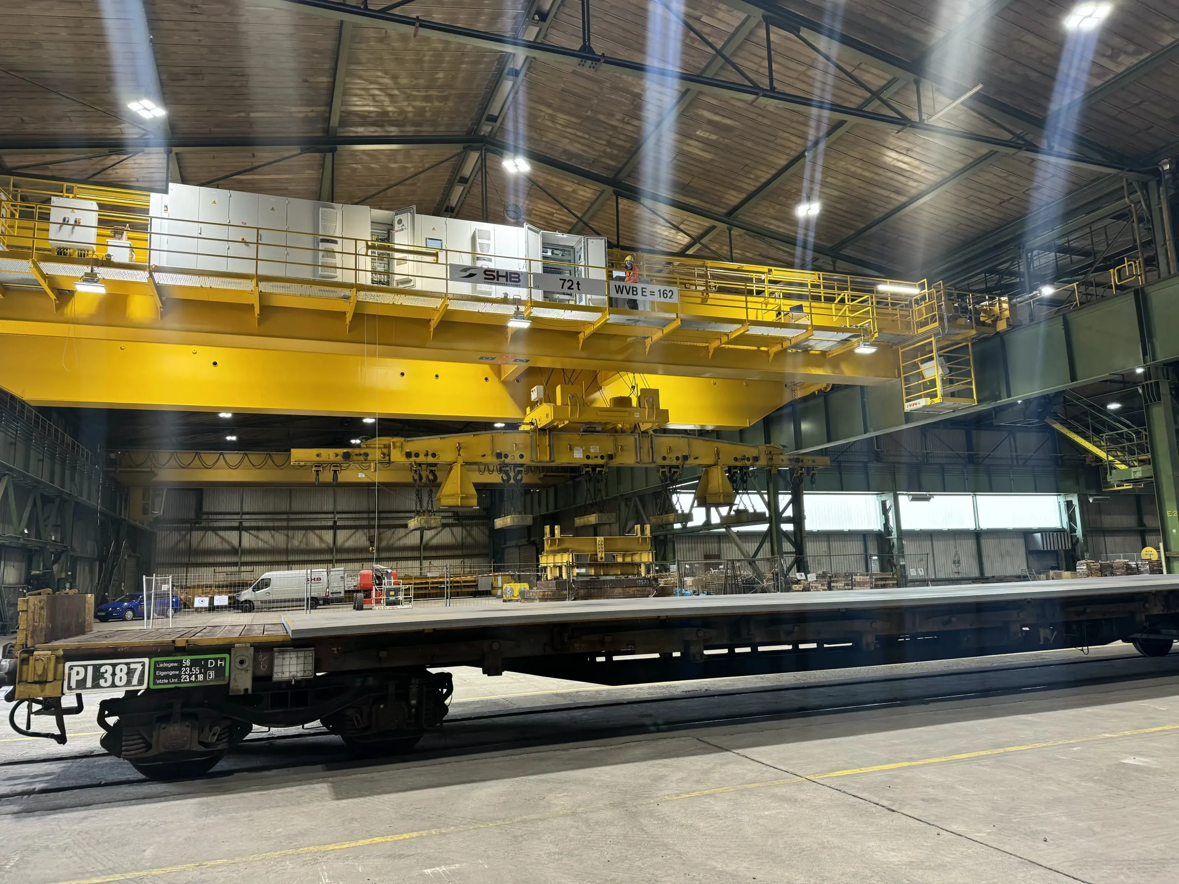 Crane with lifting magnets in a steel mill hall